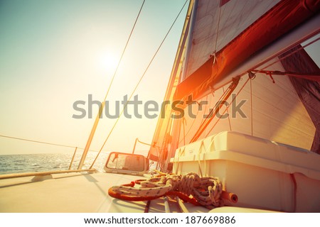 Sail boat in an open sea at sunny day