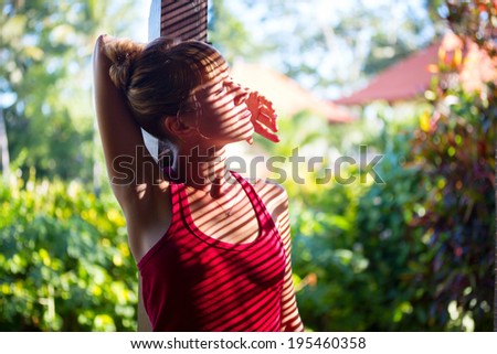Portrait of the young lady relaxing in the garden