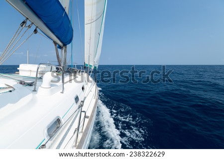 Sail boat moving in the open sea