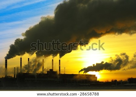 Smoking plant over sunset