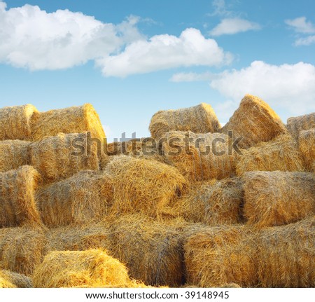 Stock of straw packs under blue sky