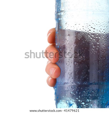 Wet plastic bottle in hand