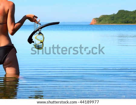 Young woman with diving equipment
