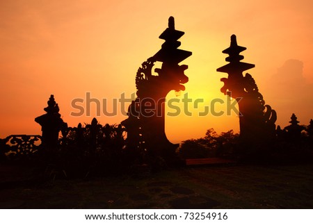 Indonesian old temple Pura Besakih. Temple gate at red sunset light. Bali