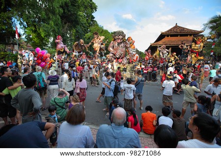 BALI, INDONESIA - MARCH 22: People on square ready to start Hindu Ngrupuk parade on March 22, 2012 in Ubud, Bali. Hindu Ngrupuk rituals  is performed in order to vanquish the negative spirits