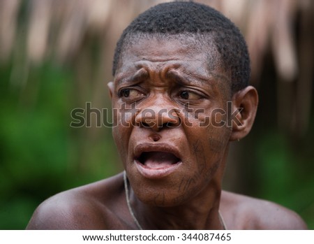 DZANGA-SANHA FOREST RESERVE, CENTRAL AFRICAN REPUBLIC - NOVEMBER 5, 2008: Portrait of a man from a tribe of pygmies. Dzanga-Sangha Forest Reserve, Central African Republic, November 5, 2008