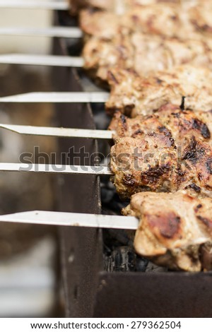 meat on outdoor grill background barbecue sticks