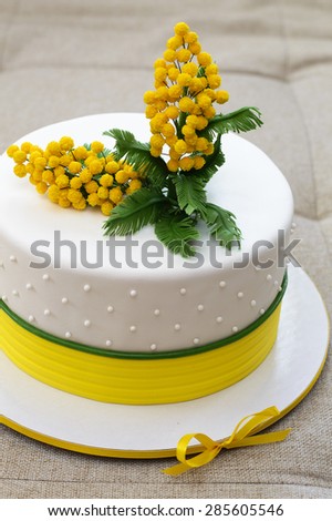 cake with sugar mimosa covered with mastic