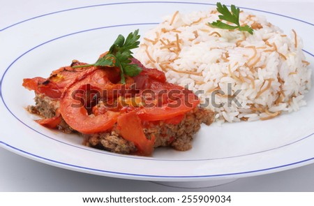Traditional Middle Eastern oven baked tomato minced meat with rice on a white background (Kufftah)