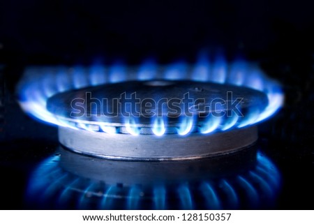 Fire and its reflection on gas-top range