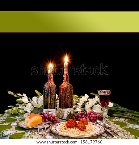 Italian dinner with candles dripping with melted wax on black background with area for text input
