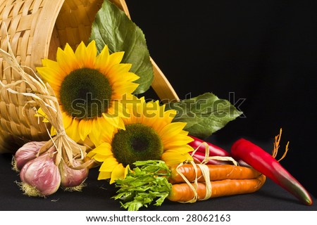 Country basket filled with sunflowers and veggies