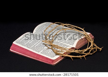 Open Bible with crown of thorns resting upon it