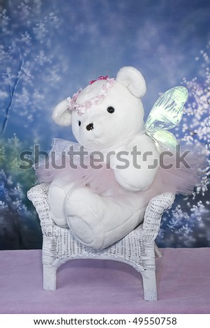Ballerina/Angel Teddy Bear children\'s photo - bear sitting in a chair alone.