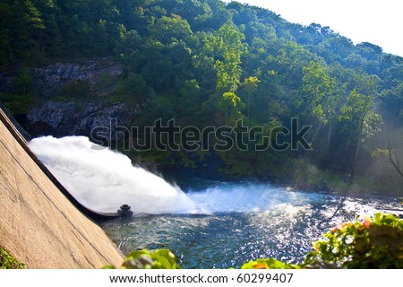 Nature image of a powerful and beautiful dam - steps lead down to the dam