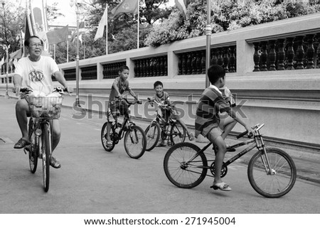 Bangkok Thailand April-23 Anonymous Children and man rid their bicycle joyfully in local community on April, 23, 2015 at Bangkok Thailand.