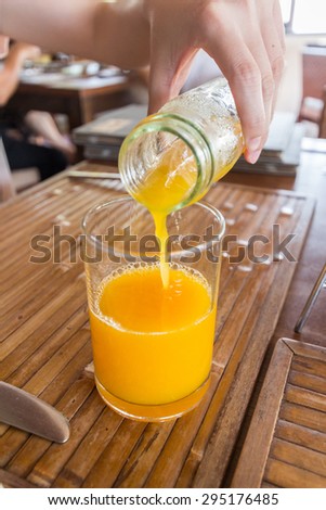 Pouring the orange juice