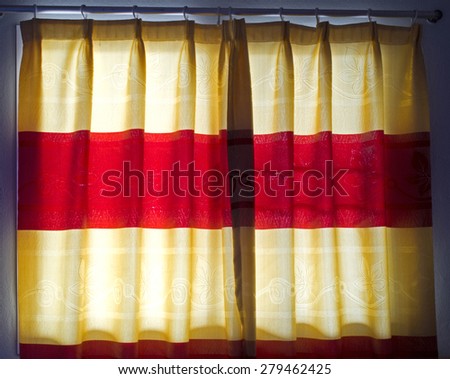 Blinds, curtains, drape golden and red color at window