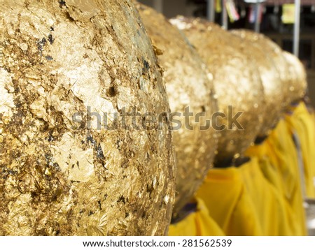 Gold leaf on loknimit (golden sphere) in Thai temple