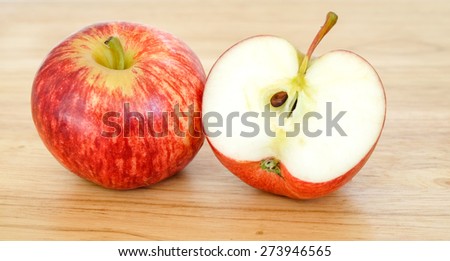 Two apples on cutting board close up