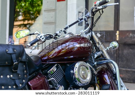 Szeged, Hungary - May 30th, 2015: Photo shoot of Yamaha Drag Star 1100 XVS bike from 2002, closeup shoot of a side of a bike and steering wheel. 4-stroke SOHC V-twin engine, 1063cc.