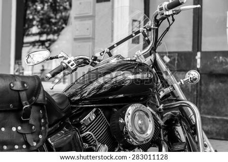 Szeged,Hungary - May 30th, 2015:Photo shoot of Yamaha Drag Star 1100 XVS bike from 2002,closeup shoot of a side of a bike and steering wheel.4-stroke SOHC V-twin engine, 1063cc.Black and white photo.