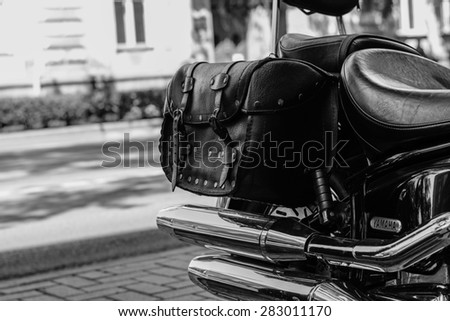Szeged, Hungary - May 30th, 2015: Photo shoot of Yamaha Drag Star 1100 XVS bike from 2002, closeup shoot of aexhaust and saddlebags. 4-stroke SOHC V-twin engine, 1063cc.Black and white photo.