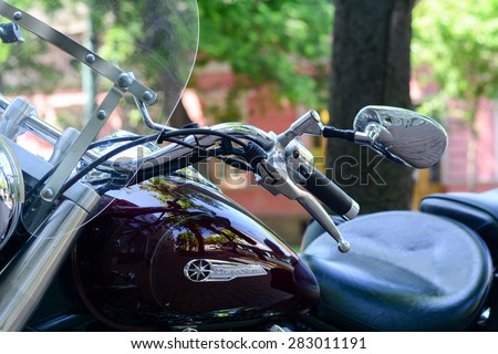 Szeged, Hungary - May 30th, 2015: Photo shoot of Yamaha Drag Star 1100 XVS bike from 2002, closeup shoot of handle,brake and mirror. 4-stroke SOHC V-twin engine, 1063cc.