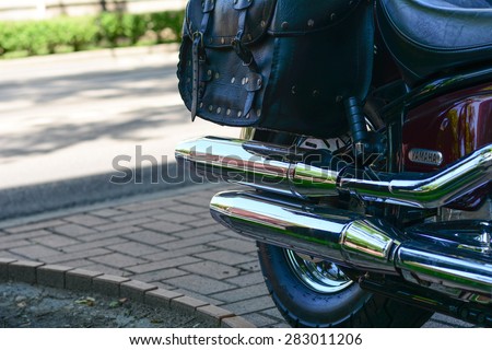 Szeged, Hungary - May 30th, 2015: Photo shoot of Yamaha Drag Star 1100 XVS bike from 2002, closeup shoot of a exhaust and saddlebags. 4-stroke SOHC V-twin engine, 1063cc.