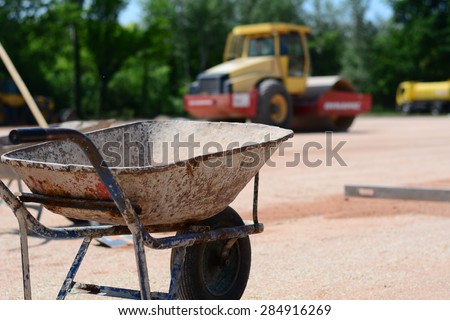 Iron cart on a construction site. In the background is big dredge. Photo was taken on a construction site near football stadium Spartak Subotica, Serbia.