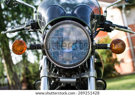 Subotica, Serbia - Jun 13, 2015: Photo shoot of Kawasaki ZR 1100 Zephyr A1 bike from 1992, close up shoot of a main light, turn signals and steering wheel with chrome parts.