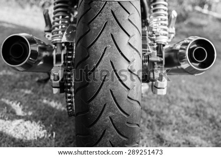 Subotica, Serbia - Jun 13, 2015: Photo shoot of Kawasaki ZR 1100 Zephyr A1 bike from 1992, close up shoot of exhaust pipes and chrome parts.1062cc, air cooled. Black and white photo.