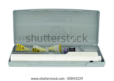 Insulin pen, compact case, disposable needles, close-up