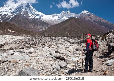 Young man on the hiking path in the mountains of Nepal - Himalayas. Background High mountains