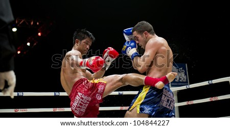 BANGKOK - JUNE 9: Muay Thai Welterweight World Championship fight - Big Ben Ch. Praram 6 (Thailand) kicking Fabio Pinca (France) at \