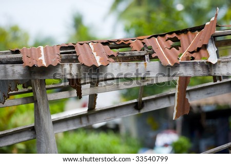 a totally damaged old roof top. picture taken with a shallow depth of field.