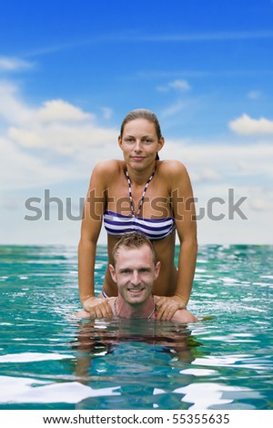 a playful couple having fun in the water