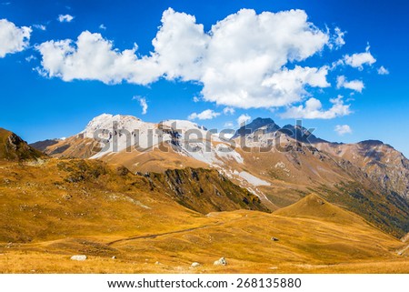 Beautiful clouds over the mountains. Picture was taken during trekking hike in  mountains of northern Caucasia at autumn, Arhiz region, Abishira-Ahuba range, Karachay-Cherkessia, Russia