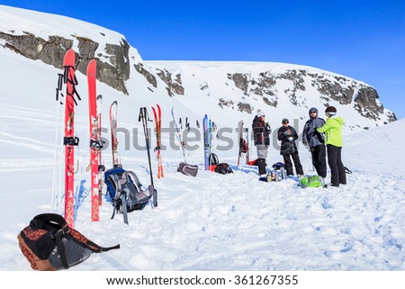 Murmansk region, Russia - April 09, 2013: group of tourists rests and drinks tea during their ski hike in the mountains of the Arctic, Hibiny