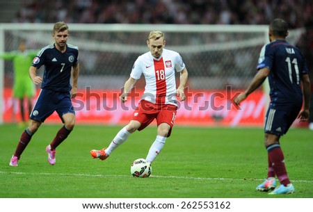 WARSAW, POLAND - OCTOBER 14, 2014: EURO 201 Football Cup Qualifiers Scotland vs Scotland\
o/p: James Morrison Sebastian Mila Ikechi Anya