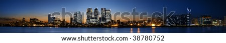 Super wide Panorama of the Canary Wharf area at sunset, London.