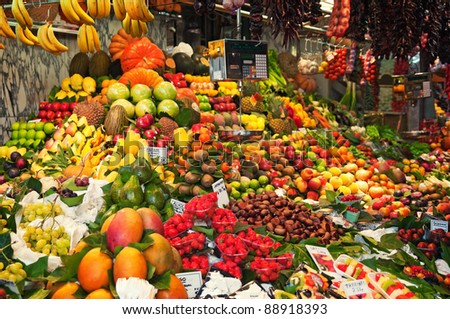 Colourful fruit and vegetable market stall in Boqueria market in Barcelona.
