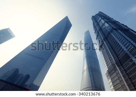 Shanghai, China: October9, 2015. Sunrise behing the Shanghai World Financial Centre, Shanghai Tower and Jin Mao Tower at Lujiazui. Shanghai Tower is newest and the tallest of a group of three.