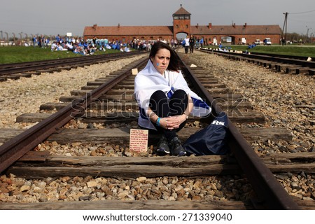 OSWIECIM, POLAND - APRIL 16, 2015: Holocaust Remembrance Day next generation of people from the all the world meets on the March of the Living in Nazi German death camp in Auschwitz Birkenau,in Poland