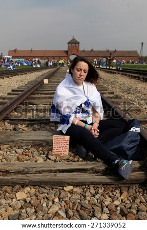 OSWIECIM, POLAND - APRIL 16, 2015: Holocaust Remembrance Day next generation of people from the all the world meets on the March of the Living in  German death camp in Auschwitz Birkenau, in Poland