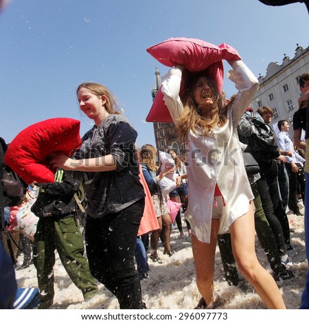 Krakow,Poland - April 11 2015:People take part in a mass pillow fight in Krakow Square in Poland