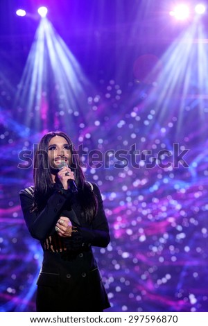KIELCE, POLAND - JUNE 27, 2015: Austrian cross-dressing diva Conchita Wurst  sings at a concert in Kiellce, Poland on Saturday June 27 , 2015