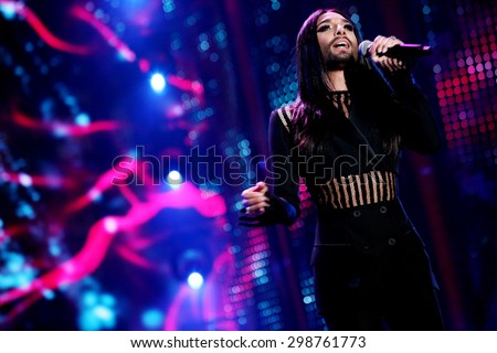 KIELCE, POLAND - JUNE 27: Austrian cross-dressing diva Conchita Wurst  sings at a concert in Kiellce, Poland on Saturday June 27 , 2015