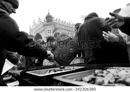 KRAKOW, POLAND - DECEMBER 22, 2013; Christmas Eve for poor and homeless on the Central Market in Cracow. Every year the group Kosciuszko prepares the greatest eve in the open air in Poland.
