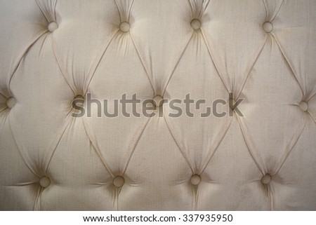 a beautiful cream color texture and design of cloth sofa for abstract background